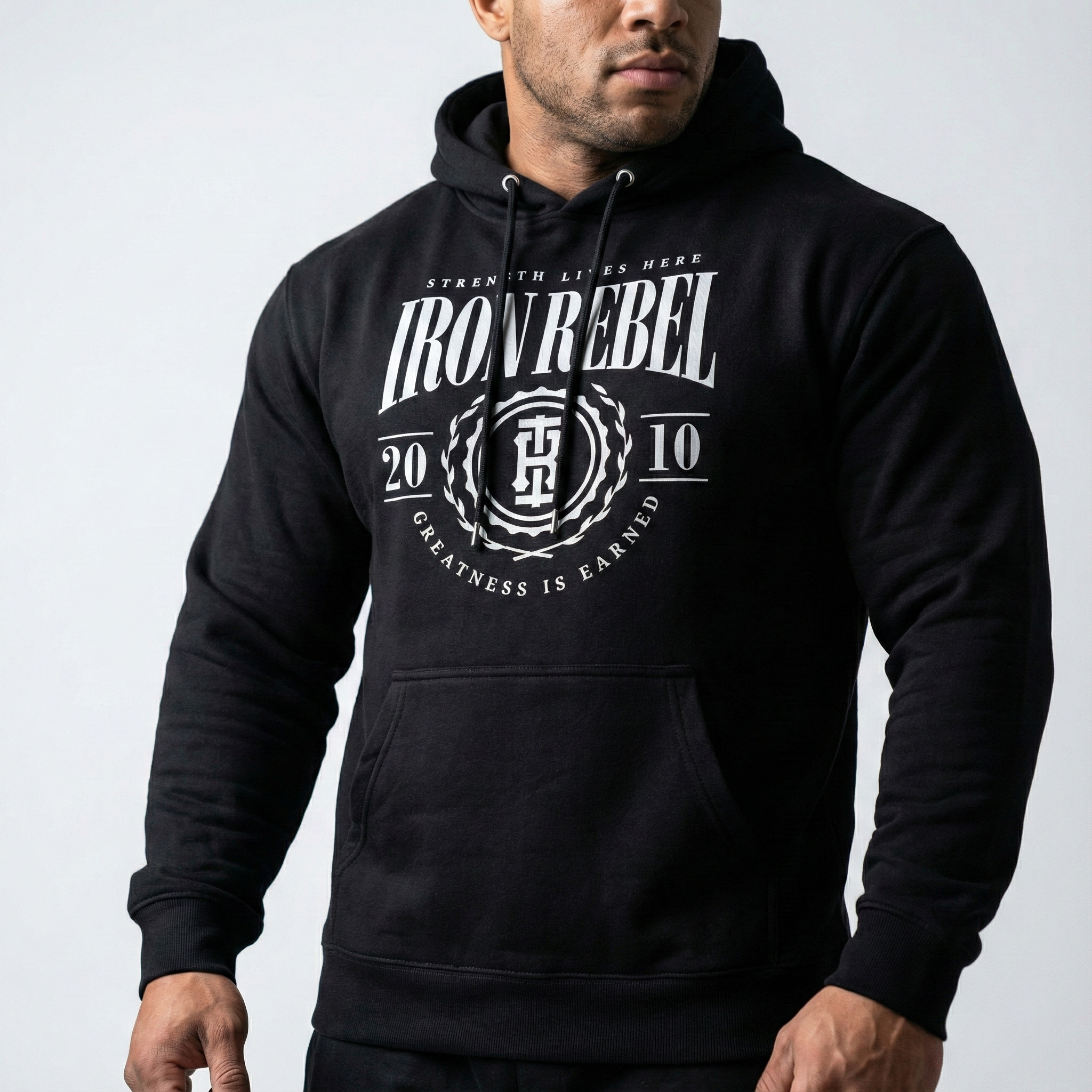 Iron Rebel black pullover hoodie for men with classic strength crest logo, heavyweight gym sweatshirt front view, powerlifting and bodybuilding wear